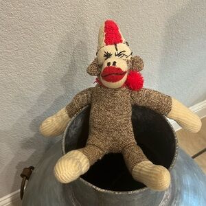 Vintage stuffed sock monkey, maybe antique.